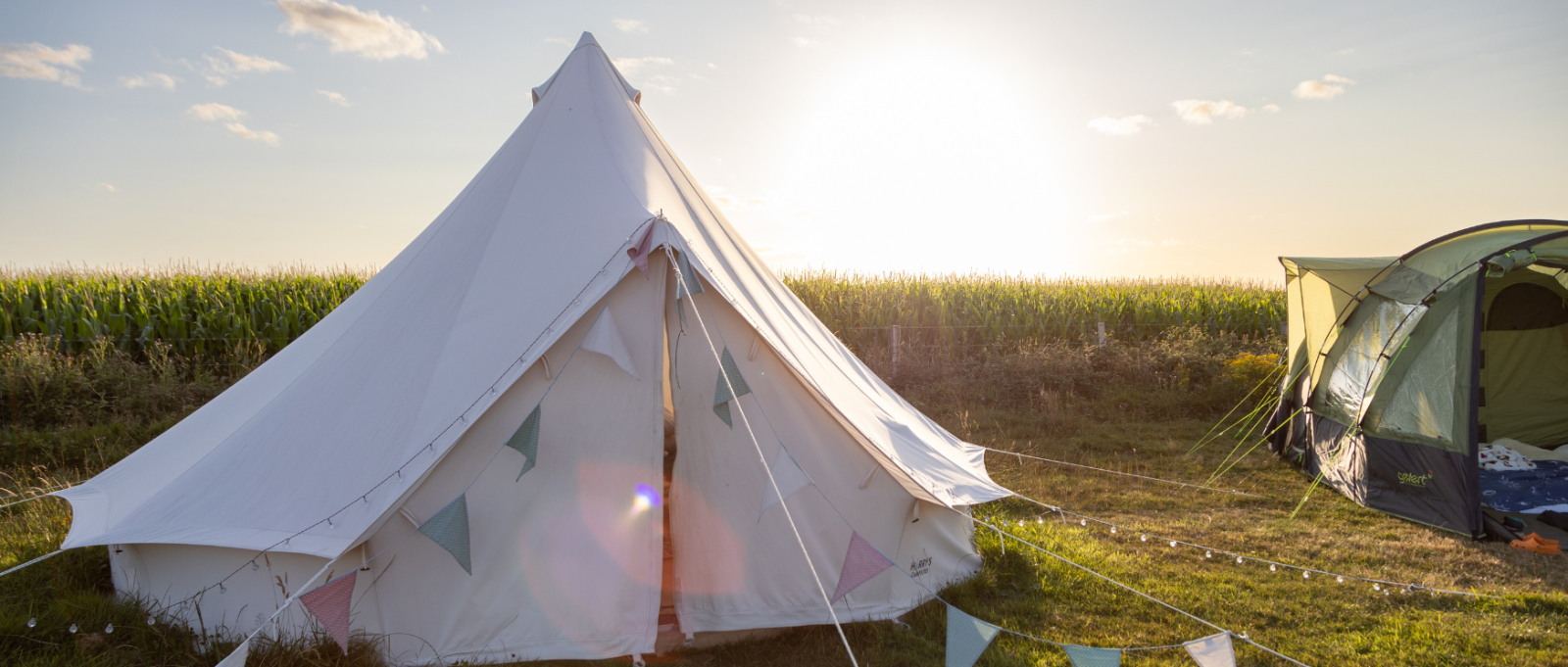 Bell tent and regular tent at The Old Airfield campsite